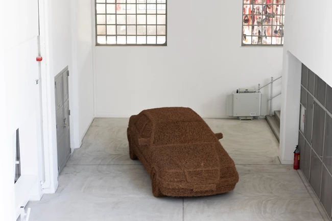 Martha Dimitropoulou (b. 1972, Athens, Greece)MERCEDES S500, 2013 Pine needles, wood, wire 1.60x5.5x2.4m Installation View, Dream On, 2022 | Hellenic Parliament + NEON at the former Public Tobacco Factory, Athens